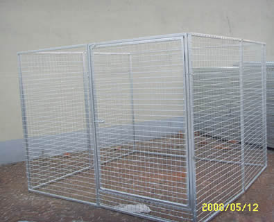 A galvanized dog kennel with gate and locking gate latch.